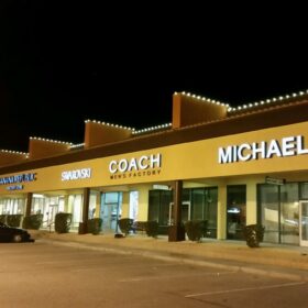 white holiday lights Michaels Kors Coach strip mall