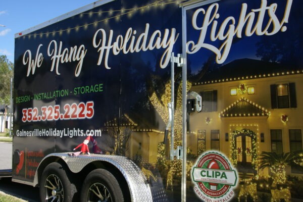 Gainesville Holiday Light Elf shows off the light hanging trailer