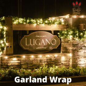 garland around lugano sign christmas display holiday lights